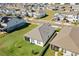 Aerial view of a house and community with solar panels and a lake at 5157 Citrus Leaf Blvd, Winter Garden, FL 34787