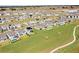 Aerial view of houses and a park near a lake at 5157 Citrus Leaf Blvd, Winter Garden, FL 34787