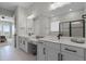 Double vanity bathroom with modern finishes and large mirror at 5157 Citrus Leaf Blvd, Winter Garden, FL 34787