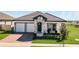 One-story home with two-car garage and nicely landscaped front yard at 5157 Citrus Leaf Blvd, Winter Garden, FL 34787