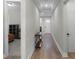 Bright hallway with wood floors and access to bedrooms and other rooms at 5157 Citrus Leaf Blvd, Winter Garden, FL 34787