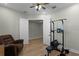 Home gym with weight bench, pull-up bar and additional space for exercise at 5157 Citrus Leaf Blvd, Winter Garden, FL 34787