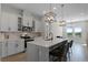 Modern kitchen with white cabinets and quartz countertops at 5157 Citrus Leaf Blvd, Winter Garden, FL 34787