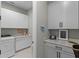 Bright laundry room with cabinets and counter space at 5157 Citrus Leaf Blvd, Winter Garden, FL 34787