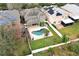 Aerial view of house with pool and solar panels at 528 Legacy Park Dr, Casselberry, FL 32707