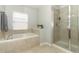 Bathroom with soaking tub and walk-in shower at 528 Legacy Park Dr, Casselberry, FL 32707