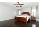 Main bedroom with dark wood floors and a wood bed frame at 528 Legacy Park Dr, Casselberry, FL 32707