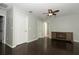 Bonus room with dark wood floors and ceiling fan at 528 Legacy Park Dr, Casselberry, FL 32707