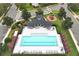 Community pool with lounge chairs and playground at 528 Legacy Park Dr, Casselberry, FL 32707