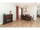 Dining room with a wood table and chairs, hardwood floors, and red curtains at 528 Legacy Park Dr, Casselberry, FL 32707