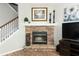 Stone fireplace with a black metal screen and a wood mantel at 528 Legacy Park Dr, Casselberry, FL 32707