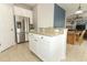 Kitchen island with granite countertop and white cabinets at 528 Legacy Park Dr, Casselberry, FL 32707