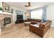 Living room with a sectional sofa, coffee table, and hardwood floors at 528 Legacy Park Dr, Casselberry, FL 32707