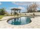 Relaxing kidney-shaped pool and pergola at 528 Legacy Park Dr, Casselberry, FL 32707