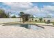 Kidney-shaped pool with pergola and fire pit at 528 Legacy Park Dr, Casselberry, FL 32707