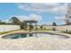 Inviting kidney-shaped pool with pergola at 528 Legacy Park Dr, Casselberry, FL 32707