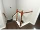 Wooden staircase with a white railing and dark wood floors at 528 Legacy Park Dr, Casselberry, FL 32707