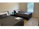 Two twin beds, nightstands, and ample closet space at 5352 Diplomat Ct # 103, Kissimmee, FL 34746