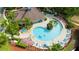 Resort-style pool with plenty of lounge chairs and a clubhouse at 5352 Diplomat Ct # 103, Kissimmee, FL 34746