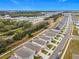 Aerial view of a residential neighborhood with houses and a railway at 5381 Maddie Dr, Haines City, FL 33844