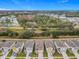 Aerial view of row houses with gray roofs and colorful accents at 5381 Maddie Dr, Haines City, FL 33844