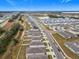 Aerial view of a residential neighborhood with houses and streets at 5381 Maddie Dr, Haines City, FL 33844