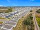 Aerial view of a neighborhood with houses near a railroad at 5381 Maddie Dr, Haines City, FL 33844