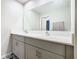 Modern bathroom with double vanity and large mirror at 5381 Maddie Dr, Haines City, FL 33844