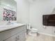 Bathroom with shower/tub and gray vanity at 5381 Maddie Dr, Haines City, FL 33844