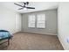 Bright bedroom with neutral walls, ceiling fan, and carpet at 5381 Maddie Dr, Haines City, FL 33844