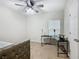 Bedroom with daybed, desk, and ceiling fan at 5381 Maddie Dr, Haines City, FL 33844