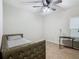 Bedroom with daybed, desk, and ceiling fan at 5381 Maddie Dr, Haines City, FL 33844