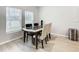 Small dining area with four chairs and a dark table at 5381 Maddie Dr, Haines City, FL 33844