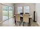 Bright dining area with sliding glass doors to backyard at 5381 Maddie Dr, Haines City, FL 33844