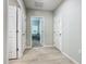 Clean hallway with light wood flooring and access to rooms at 5381 Maddie Dr, Haines City, FL 33844