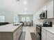 Modern kitchen with stainless steel appliances and an island at 5381 Maddie Dr, Haines City, FL 33844