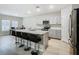 Modern kitchen with stainless steel appliances and an island at 5381 Maddie Dr, Haines City, FL 33844