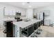 Modern kitchen with stainless steel appliances and an island at 5381 Maddie Dr, Haines City, FL 33844