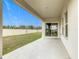 Spacious backyard patio with sliding glass doors at 5381 Maddie Dr, Haines City, FL 33844