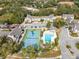 Aerial view showing tennis court, pool, and community at 549 Sun Ridge Pl # 104, Altamonte Springs, FL 32714