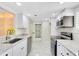 Modern kitchen with stainless steel appliances and granite countertops at 549 Sun Ridge Pl # 104, Altamonte Springs, FL 32714