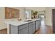 Modern kitchen island with white countertop and gray cabinets at 5863 Galloping Dr, Apopka, FL 32712