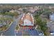 Aerial view of townhomes featuring reserved parking, complemented by mature landscaping and well-maintained surroundings at 605 Youngstown Pkwy # 32, Altamonte Springs, FL 32714