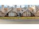 Tan two-story townhouses with brown roofs, stairs, and landscaping at 605 Youngstown Pkwy # 32, Altamonte Springs, FL 32714