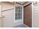 Brown front door with window and white trim at 605 Youngstown Pkwy # 32, Altamonte Springs, FL 32714