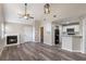 Living room with vaulted ceiling, fireplace, and laminate wood floors at 605 Youngstown Pkwy # 32, Altamonte Springs, FL 32714