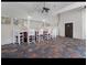 Outdoor pavilion area with ceiling fans, tiled floors, bar, and several white barstools at 605 Youngstown Pkwy # 32, Altamonte Springs, FL 32714