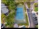 Aerial view of the blue and green tennis court, parking, and complex buildings nearby at 605 Youngstown Pkwy # 32, Altamonte Springs, FL 32714