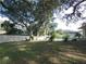 Large backyard with mature trees and pool at 749 E Yorkshire Dr, Deland, FL 32724