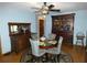 Dining room with antique furniture and a decorative ceiling fan at 749 E Yorkshire Dr, Deland, FL 32724